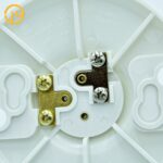 Side view of round white plastic E26 lamp socket