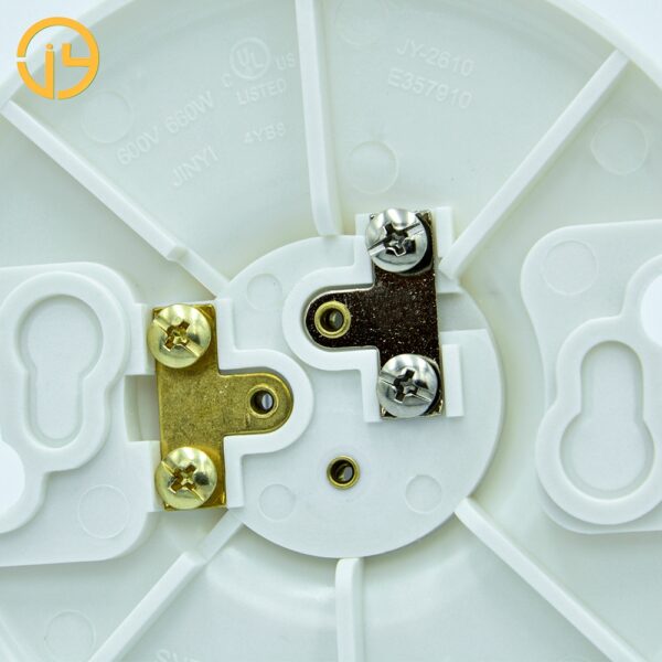Side view of round white plastic E26 lamp socket